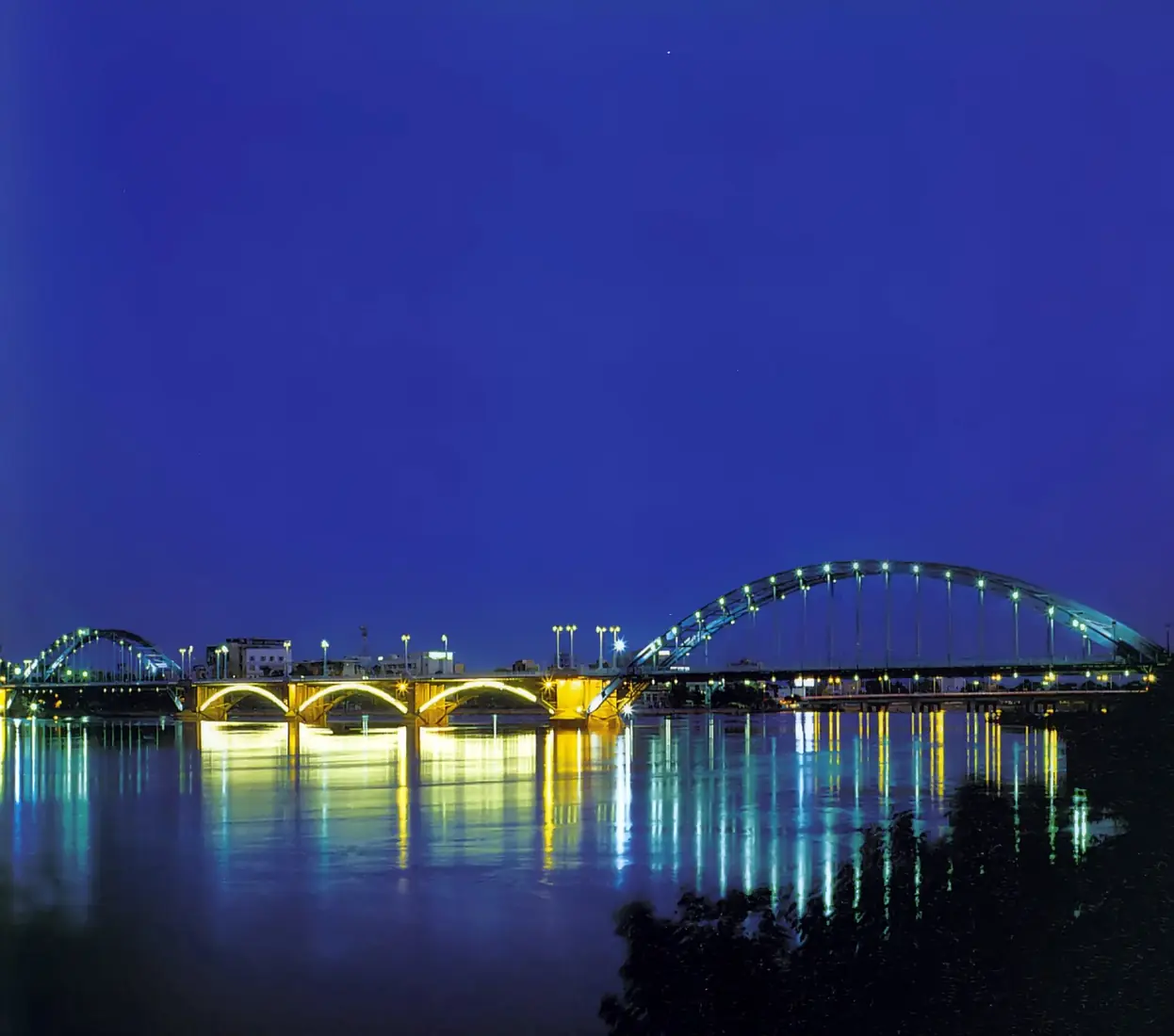 Ahwaz bridges illuminated over the Karun River at night